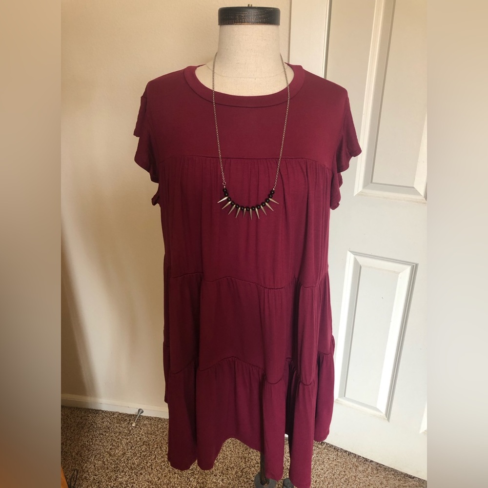Stretchy jersey a-line dress. Can be belted but designed to free flow.